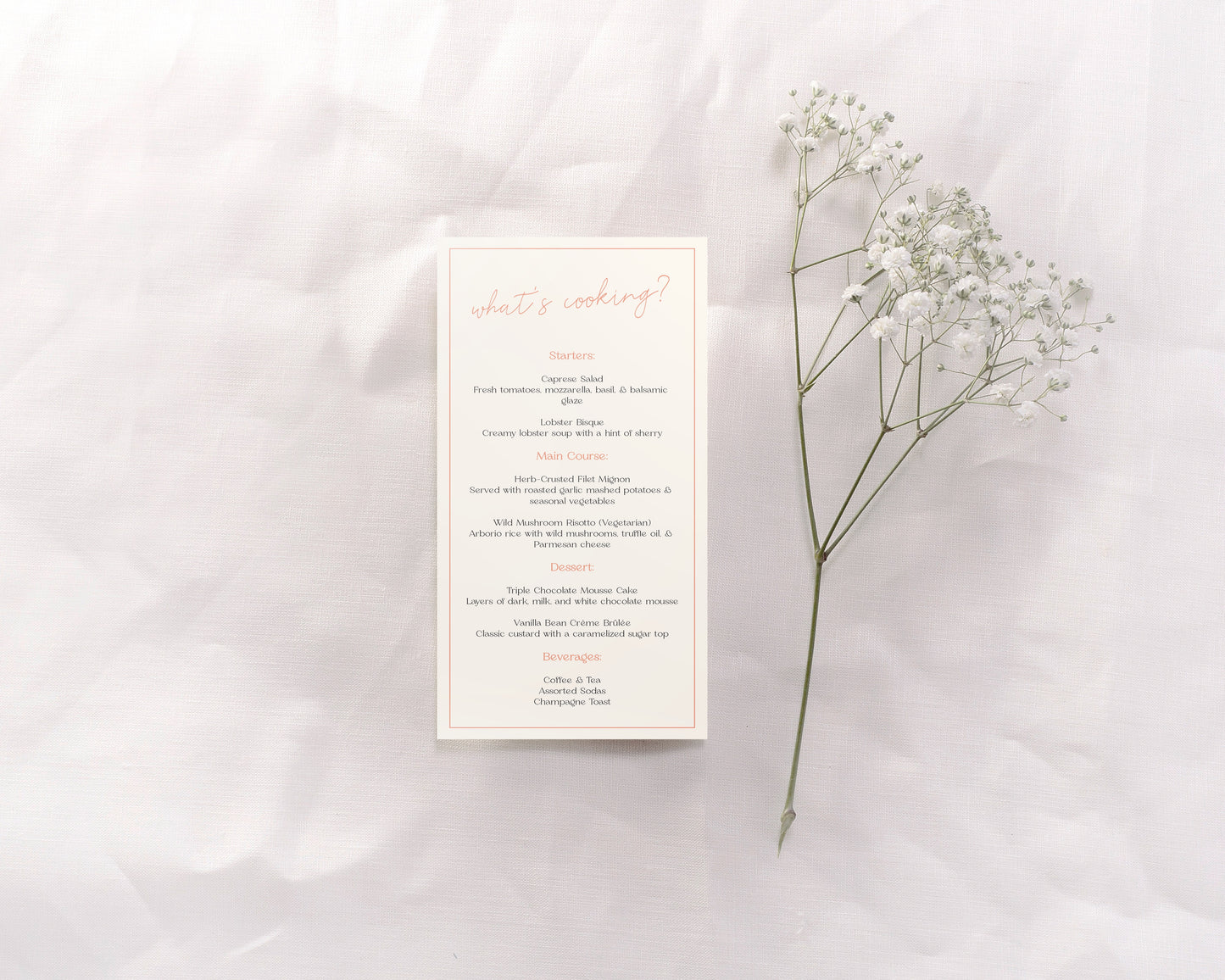 A wedding menu card featuring an understated yet chic design. The header reads "What's cooking?" in a light, elegant script at the top. The menu is divided into sections—Starters, Main Course, Dessert, and Beverages—with each section title in a soft coral color. The detailed descriptions are in a classic, minimalist black font, organized neatly and spaced for easy readability.