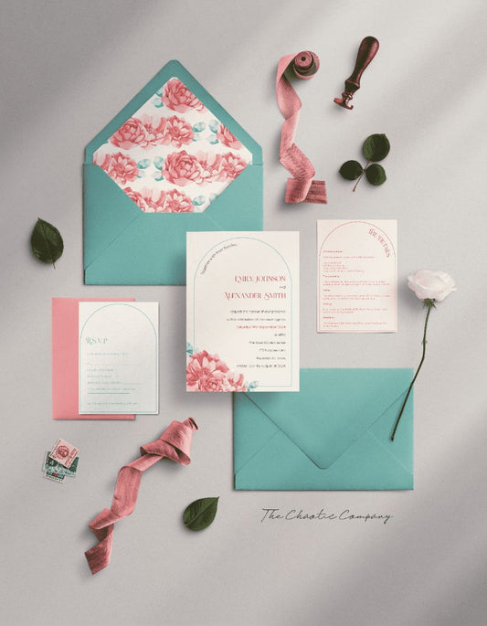 This image showcases a full wedding invitation suite styled in elegant pink and teal tones. The set includes an invitation card featuring the names "Emily Johnson and Alexander Smith," a details card, an RSVP card, and a floral-lined teal envelope. The invitation and details cards have soft floral accents, while the RSVP card maintains a minimalist design.