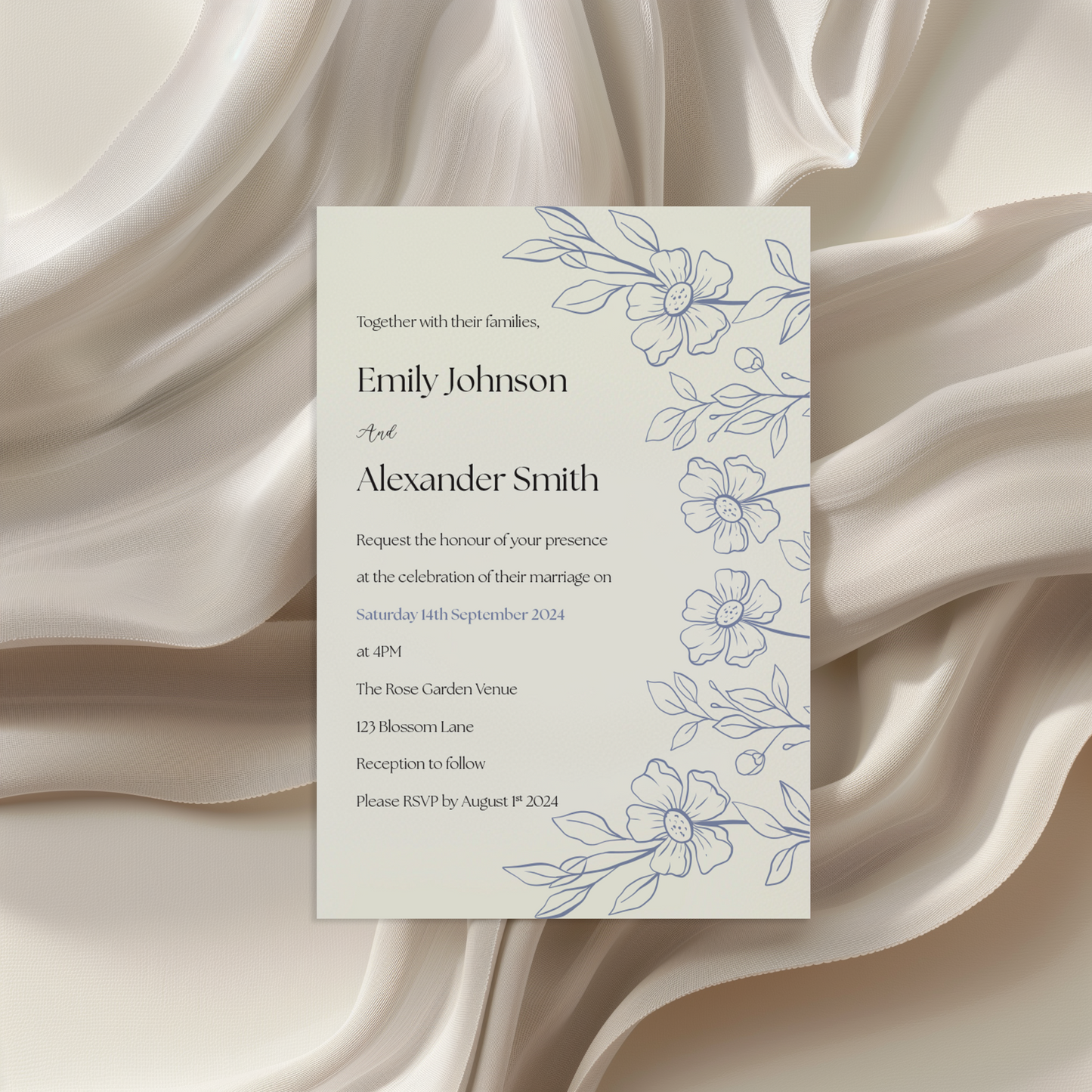 A wedding invitation card displayed on a flowing, creamy fabric background. The card features elegant blue floral illustrations along the right side and a clean, modern text layout. It invites guests to the wedding of Emily Johnson and Alexander Smith on 14th September 2024 at The Rose Garden Venue, with details provided for the ceremony and reception.