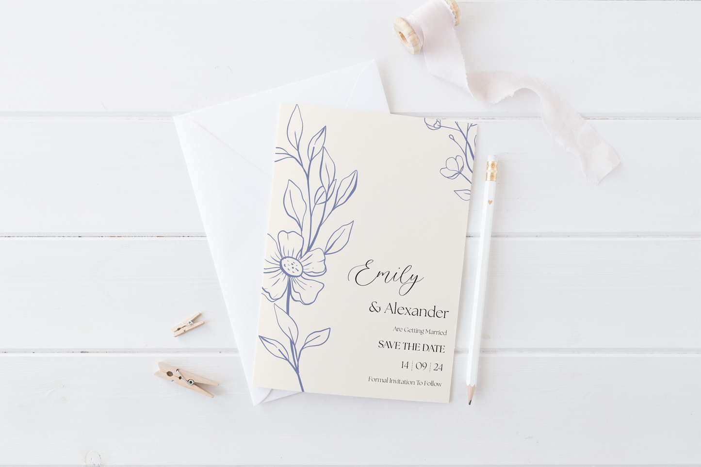 A soft cream "Save the Date" card for Emily and Alexander's wedding, featuring elegant blue floral illustrations along the left side. The names "Emily & Alexander" are printed in a sophisticated script, with the wedding date "14.09.24" and the message "Formal Invitation to Follow" below in a clean, modern font.