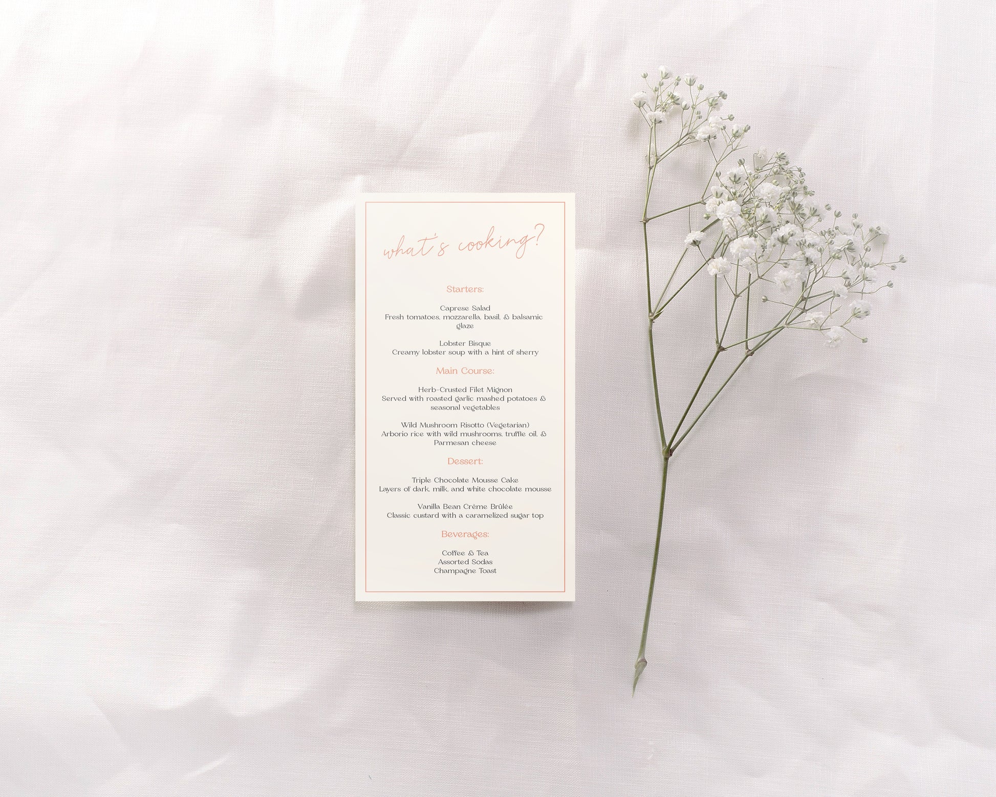 A wedding menu card featuring an understated yet chic design. The header reads "What's cooking?" in a light, elegant script at the top. The menu is divided into sections—Starters, Main Course, Dessert, and Beverages—with each section title in a soft coral color. The detailed descriptions are in a classic, minimalist black font, organized neatly and spaced for easy readability. 