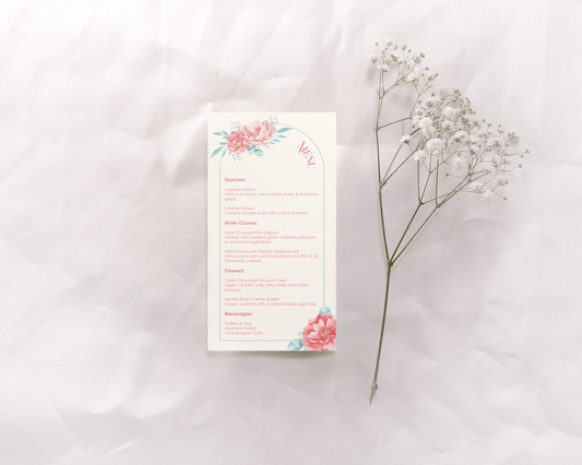 A wedding menu card featuring a soft floral design at the top and bottom, with the word "Menu" elegantly curved on the right side. The card is divided into sections: Starters, Main Course, Dessert, and Beverages, all listed in a clear serif font. 